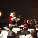 Santa took his turn at the podium to lead the band.