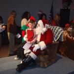 After the concert, Santa listened to the Christmas wishes of the good little boys and girls.